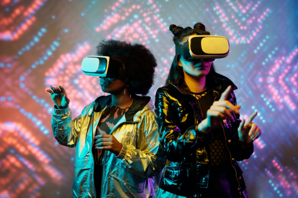 Two women wearing VR headsets with a futuristic background 